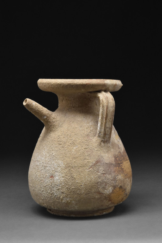 HELLENISTIC POTTERY STRAINER JUG
Ca. 300-200 BC. A bright brown pottery straine...