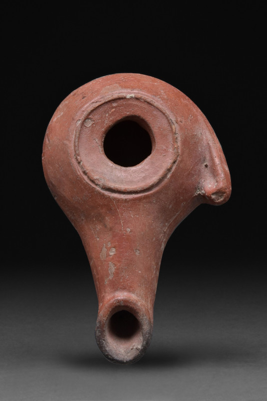 HELLENISTIC TERRACOTTA OIL LAMP
Ca. 1st century BC - 1st century AD . A terraco...