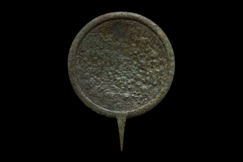 ROMAN BRONZE MIRROR
Ca. 100-300 AD. A bronze circular mirror featuring the obve...