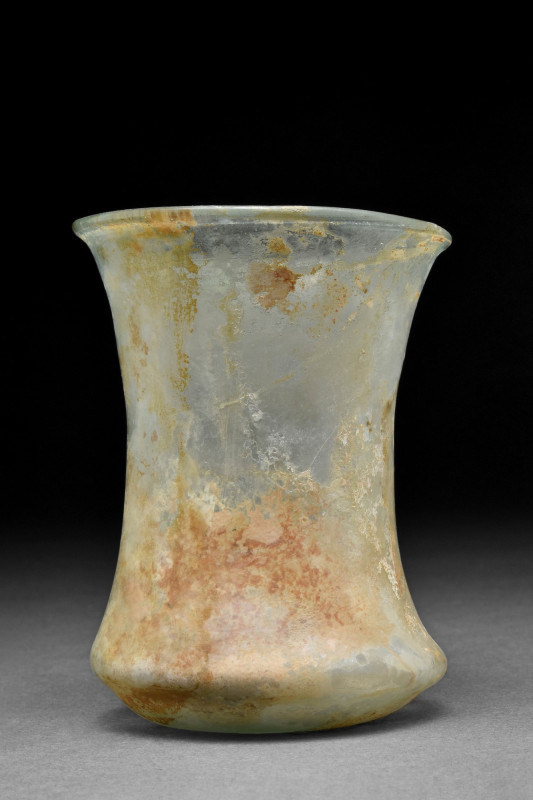 ROMAN GLASS BEAKER
Ca. 200-300 AD. A yellowish-light green glass beaker with a ...