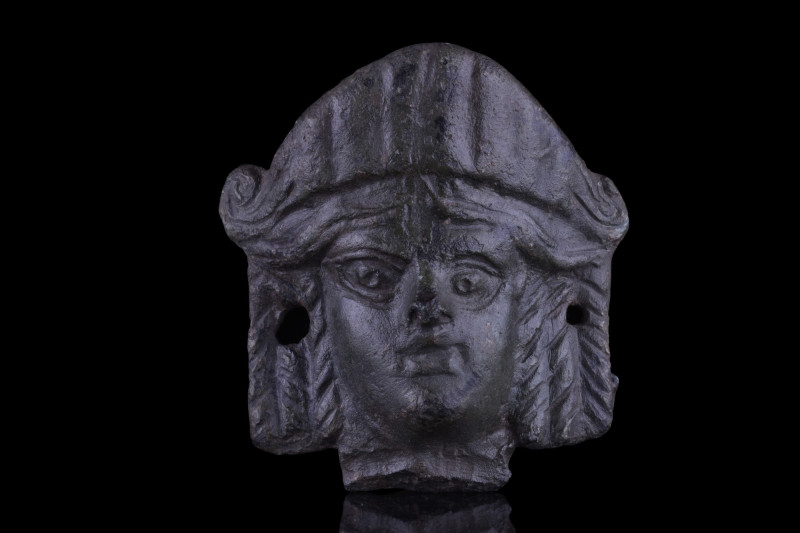 ROMAN BRONZE FEMALE HEAD WITH STEPHANE
Ca. 1-100 AD. A hollow cast bronze fitti...