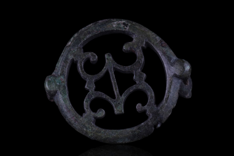 ROMAN BRONZE OPEN-WORK BROOCH
Ca. 100-200 AD. A bronze disk brooch with openwor...