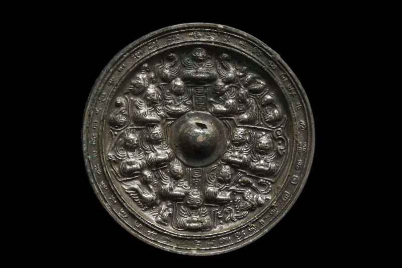 CHINESE TANG DYNASTY BRONZE DECORATED MIRROR
Ca. 618-907 AD. A circular bronze ...