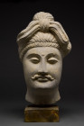 GANDHARAN SCHIST HEAD OF A BODHISATTVA