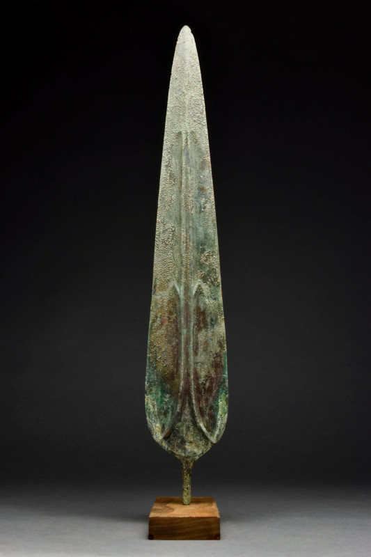 ANCIENT BRONZE SPEAR
Ca. 1200-700 BC. A two-edged bronze blade, leaf-shaped wit...