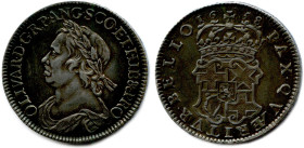 ANGLETERRE - OLIVIER CROMWELL 1653-1658
Demi-couronne d'argent 1658. Thomas Simon. Tranche inscrite en relief. (14,97 g) ♦ S 3227A 
Patine sombre de...
