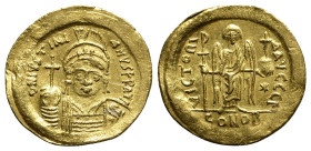 Justinian I (527-565). AV Solidus (20.5mm, 4.40g, 6h). Constantinople, 545-565. Helmeted and cuirassed bust facing, holding globus cruciger and shield...