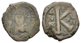 Justinian I (527-565). Æ 20 Nummi (24mm, 10.00g). Constantinople, year 17 (543/4). Helmeted and cuirassed bust facing, holding globus cruciger and car...