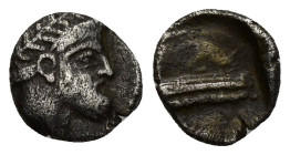 Phoenicia, Arados AR Obol. (9mm, 0.8 g) Circa 380-350. Laureate head of Ba'al-Arwad right / Galley sailing right over waves within square.