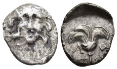 CARIA, Mylasa. Early-mid 2nd century BC. AR Drachm (16mm, 2 g). Pseudo-Rhodian type. Are–, magistrate. Head of Helios facing; bird at cheek to left / ...