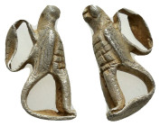 Roman Silver Eagle Pendant. 1st-2nd century AD. A silver pendant of a perching eagle on a rectangular base with dentilled edges. 14mm, 1.4 g