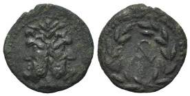 Sicily, Uncertain Roman mint, late 2nd century BC. Æ As (22mm, 5.04g, 6h). Laureate and bearded head of Janus; I above. R/ Monogram within laurel-wrea...
