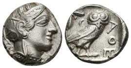 Attica, Athens, c. 454-404 BC. AR Tetradrachm (23,4 mm, 17,11 g). Head of Athena right, wearing crested Attic helmet decorated with three olive leaves...