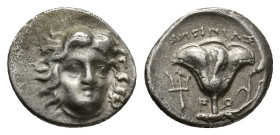 Islands off Caria, Rhodes, c. 299-205 BC. AR Hemidrachm (14,00 mm, 2,97 g). Head of Helios facing slightly right R/ Rose with bud; trident in left fie...