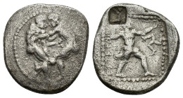 Pamphylia, Aspendos, c. 420-410 BC. AR Stater (22.5mm, 10.76g). Two wrestlers grappling R/ Slinger in throwing stance right; triskeles to right; all w...