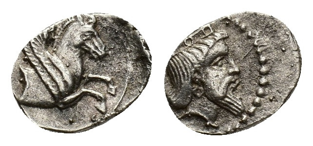 Cilicia, Uncertain mint, c. 4th century BC. AR Obol (8,7 mm, 0,67 g). Crowned ma...