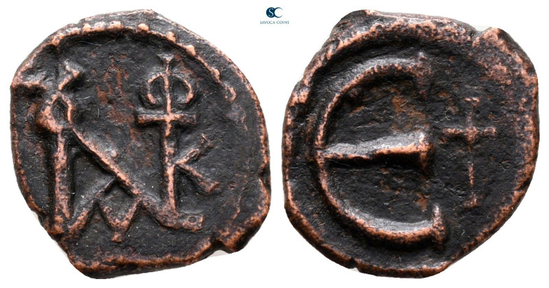 Justin II AD 565-578. Constantinople
Pentanummium Æ

14 mm, 1,66 g



ver...