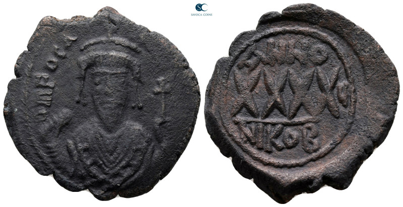 Phocas AD 602-610. Nikomedia
Follis or 40 Nummi Æ

31 mm, 10,91 g



very...