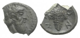 Sicily, Naxos, c. 461-430 BC. AR Litra (10mm, 0.53g, 6h). Wreathed head of Dionysos r. R/ Grape bunch on vine. HGC 2, 969. Rare, chipped otherwise VF