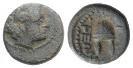 Macedon, Orthagoreia, c. 350 BC. Æ (12mm, 2.50g, 9h). Laureate head of Apollo r. R/ Macedonian helmet surmounted by a star. SNG ANS 566-70. About VF
