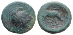 Macedon, Pella, c. 187-168/7 BC. Æ (17mm, 5.04g, 12h). Helmeted head of Athena r. R/ Cow grazing r. SNG ANS 606. Dark green patina, near VF