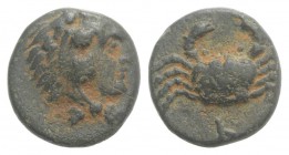 Islands of Caria, Kos, 4th century BC. Æ (10mm, 1.55g, 6h). Head of Herakles r., wearing lion skin. R/ Crab. Cf. SNG Keckman 290-2. Brown patina, VF