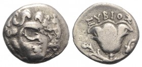 Islands of Caria, Rhodes, c. 275-250 BC. AR Drachm (14mm, 2.45g, 12h). Eubios, magistrate. Head of Helios facing slightly l.; dolphin r., within recta...