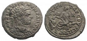 Caracalla (198-217). Cilicia, Tarsus. AR Didrachm (24mm, 5.65g, 6h), AD 215-7. Laureate head r. R/ TYXH TAPCOY METP, Tyche seated l. on rocks, holding...