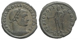 Diocletian (284-305). Æ Follis (27mm, 8.84g, 6h). Heraclea, c. 296-7. Laureate head r. R/ Genius standing l., holding patera and cornucopiae; HTΔ. RIC...