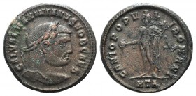 Galerius (Caesar, 293-305). Æ Follis (28mm, 11.63g, 12h). Heraclea, c. 296/7. Laureate head r. R/ Genius standing l., holding patera and cornucopia; H...