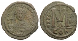 Justinian I (527-565). Æ 40 Nummi (39mm, 20.78g, 6h). Constantinople, year 13 (539/40). Helmeted and cuirassed facing bust, holding globus cruciger an...