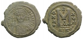 Justinian I (527-565). Æ 40 Nummi (38mm, 20.36g, 6h). Nicomedia, year 17 (543/4). Helmeted and cuirassed facing bust, holding globus cruciger and shie...