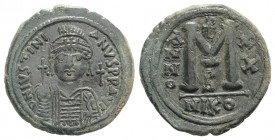 Justinian I (527-565). Æ 40 Nummi (34mm, 20.02g, 6h). Nicomedia, year 20 (546/7). Helmeted and cuirassed bust facing, holding globus cruciger and shie...