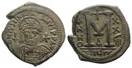 Justinian I (527-565). Æ Follis (35mm, 19.04g, 5h). Theoupolis (Antioch), year 28 (554/5). Helmeted and cuirassed facing bust, holding globus cruciger...