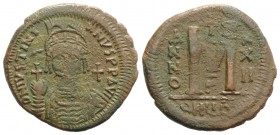 Justinian I (527-565). Æ 40 Nummi (36mm, 16.92g, 6h). Antioch, year 22 (548/9). Facing helmed and cuirassed bust, holding globus cruiciger. R/ Large M...