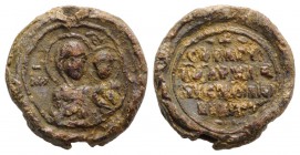 Byzantine Pb Seal, c. 7th-12th century (20.5mm, 8.96g, 6h). Facing bust of Theotokos, holding holy child. R/ Legend in four lines. Near VF