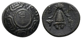 Kings of Macedon, Alexander III 'the Great'. AE, 3.97 g 16.03 mm.336-323 BC. Sardes.
Obv: Shield with caduceus on boss.
Rev: B – A, Macedonian helme...