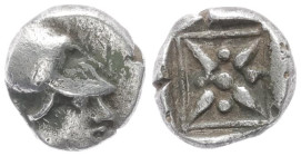 Asia Minor. Uncertain mint. AR Hemiobol, 0.41 g 6.87 mm. Circa 500-400 BC.
Helmeted head of Athena right. 
Rev: Star of four rays, pellets between ray...