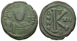 Justinian I 527-565 AD. AE, Half Follis. 2nd officina. 10.71 g. 31.44 mm. Constantinople. RY 12 (526-527).
Obv: DN IVSTIN[IANVS P]P AVG. Helmeted, cu...
