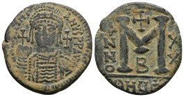 Justinian I. 527-565 AD. AE, Follis. 2nd officina. 19.78 g. 35.12 mm. Theoupolis (Antioch.). Dated RY 20 (546/7 AD.).
Obv: DN IVSTINI-ANVS PP AVΓ. He...