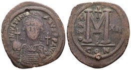 Justinian I, 527-565 AD. AE, Follis. 2nd officina. 20.06 g. 40.62 mm. Constantinople.
Obv: DN I[V]STINIANVS PP AVG. Frontal bust of Justinian I with ...