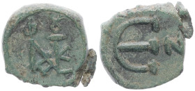Justin II 565-578 AD. AE, Decanummium. 1.88 g. 14.65 mm. Constantinople.
Obv: Justin II monogram.
Rev: Large epsilon, officina letter to right. 
Ref: ...