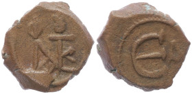 Justin II 565-578 AD. AE, Decanummium. 2.66 g. 15.83 mm. Constantinople.
Obv: Justin II monogram.
Rev: Large epsilon, officina lette (A) r to right. 
...