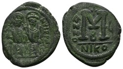 Justin II and Sophia. 565-578 AD. AE, Half Follis. 13.77 g. 30.74 mm. Nicomedia.
Obv: D N IVSTINVS P P AVG. Justin at left, Sophia at right, seated f...