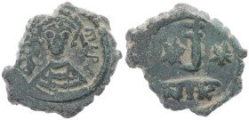 Maurice Tiberius, 582-602 AD. AE, Decanummium. 2.61 g. 17.97 mm. Nicomedia. 
Obv: DN MAVRIC PP AV, crowned and cuirassed bust facing, holding cross on...