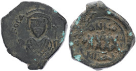 Phocas, 602-610 AD. AE, Follis. 14.15 g. 33.00 mm. Nicomedia. 
Obv: [DN] FOCA [PER AVG], crowned with pendilia, mantled bust facing, holding mappa and...