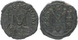 Theophilus 829-842 AD. AE, Follis. 7.69 g. 28.87 mm. Syracuse mint. 
Obv: ΘEOFIL bAS[IL]. Crowned bust facing with short beard, wearing chlamys, holdi...