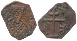 Alexius I Comnenus 1092-1181 AD. AE, Tetarteron. 0.75 g. 15.22 mm. 
Obv: Patriarchal cross on two steps, [A-Δ] K-Φ to left and right, above and below ...