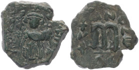 Islamic. Arab-Byzantine, Umayyad Caliphate. Pseudo-Byzantine type, imitating the types of Constans II 640-650 AD. AE, Fals. 5.59 g. 25.07 mm. Uncertai...
