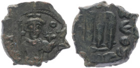 Islamic. Arab-Byzantine, Umayyad Caliphate. Pseudo-Byzantine type, imitating the types of Constans II, 640-650 AD. AE, Fals. 6.32 g. 23.51 mm. Uncerta...